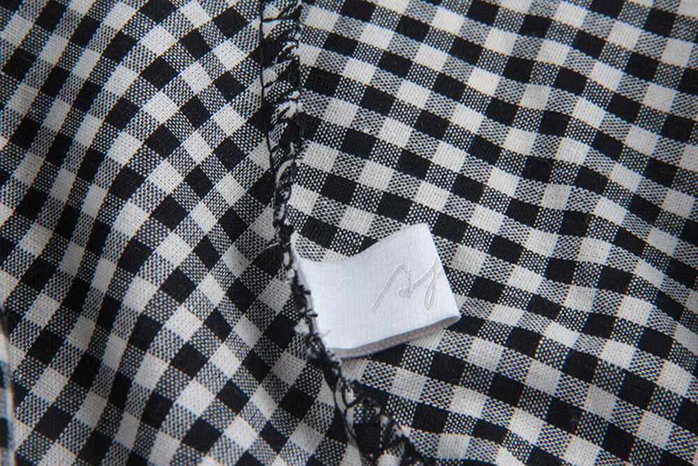 Ruffle Asymmetrical-Hem Checkered Blouse
